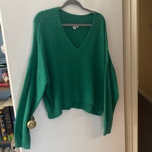 Green V-neck sweater